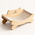 Elva cat scratcher lounge with a cat-head backrest, three-quarter view on a white background